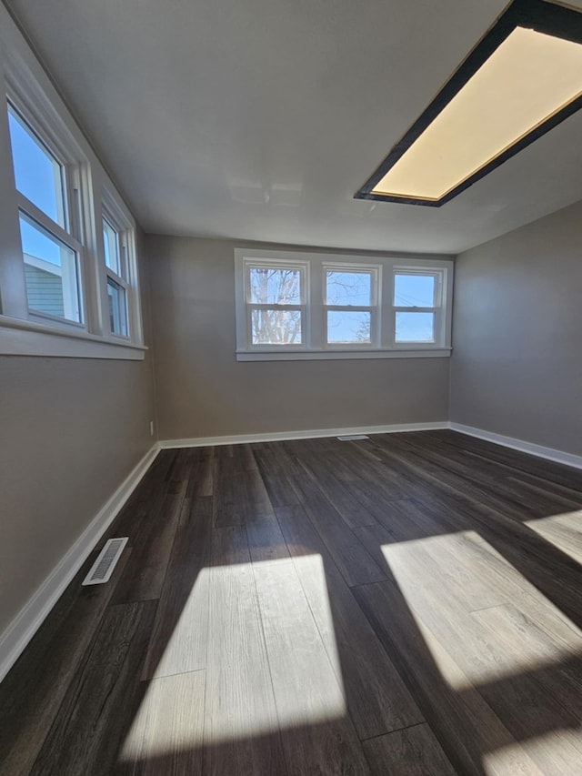 empty room featuring dark hardwood / wood-style floors