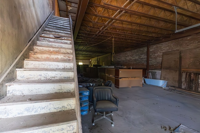 staircase with concrete flooring