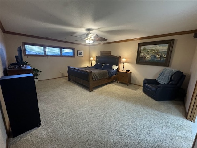 bedroom with light colored carpet, ceiling fan, and crown molding