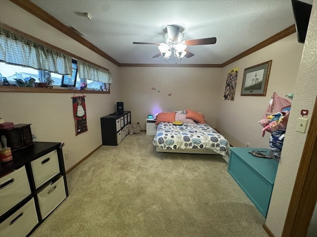 bedroom with a textured ceiling, ceiling fan, ornamental molding, and light colored carpet