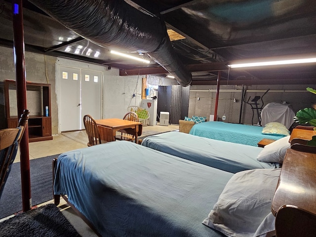 bedroom featuring concrete floors