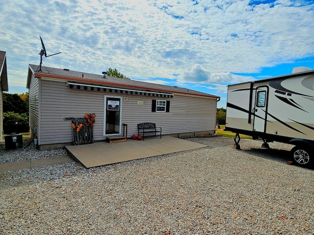 rear view of property featuring a patio area