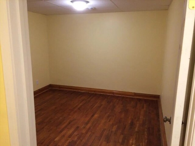 115, 117 N Rollins St, Macon, MO 63552 - spare room featuring baseboards and dark wood finished floors