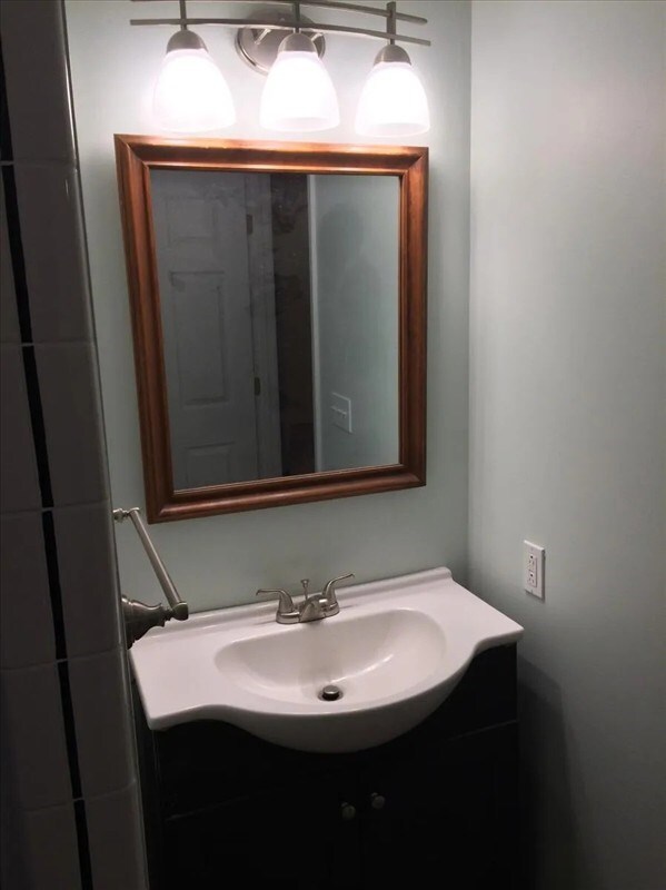 115, 117 N Rollins St, Macon, MO 63552 - bathroom featuring vanity