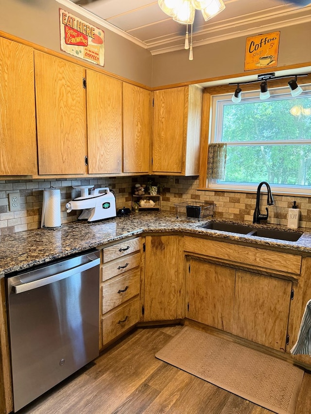 64234 Hwy 6, Green Castle, MO 63544 - kitchen featuring stainless steel dishwasher, crown molding, wood finished floors, decorative backsplash, and dark stone countertops