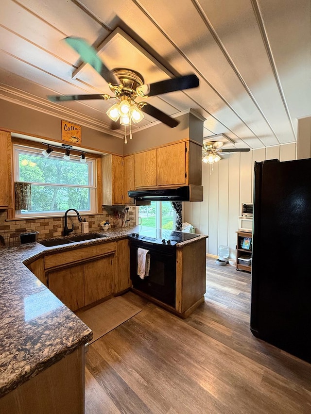 64234 Hwy 6, Green Castle, MO 63544 - kitchen with black appliances, a ceiling fan, dark countertops, and brown cabinets