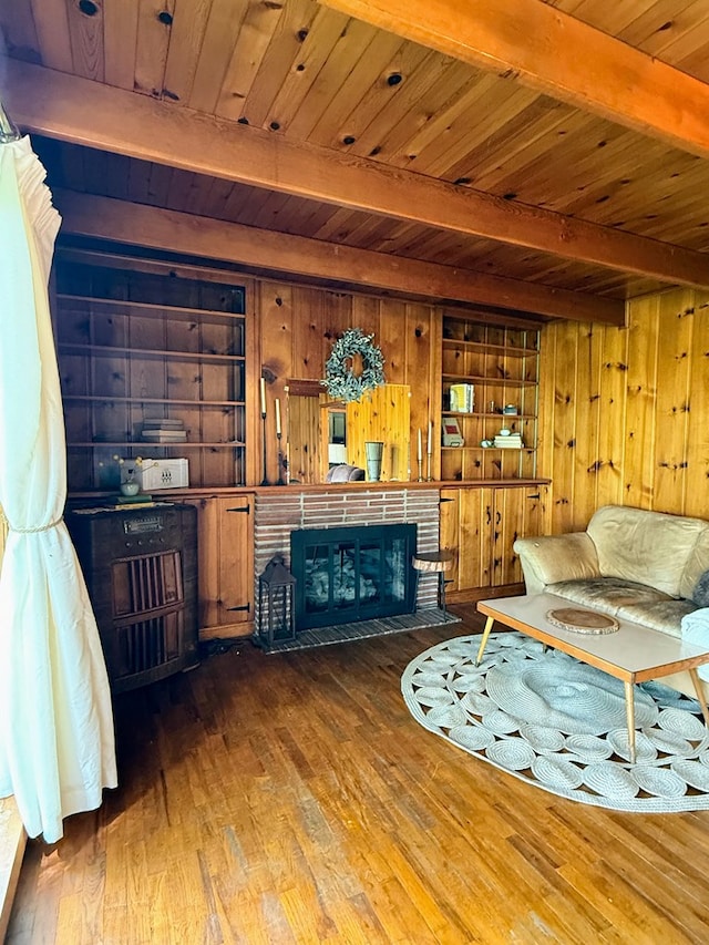64234 Hwy 6, Green Castle, MO 63544 - living room with a wood ceiling with exposed beams, wooden walls, hardwood / wood-style flooring, and a brick fireplace