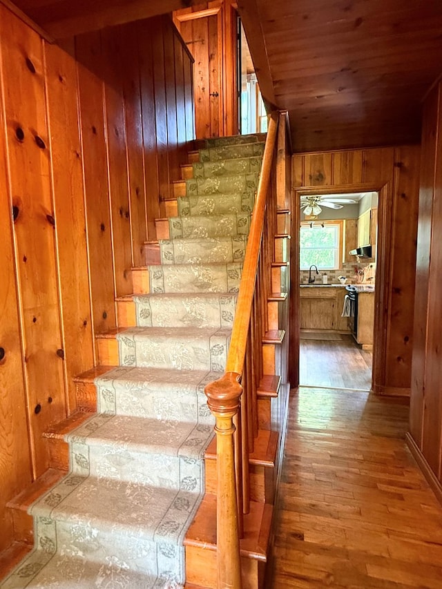 64234 Hwy 6, Green Castle, MO 63544 - stairway featuring wooden walls, wood-type flooring, a ceiling fan, and wood ceiling