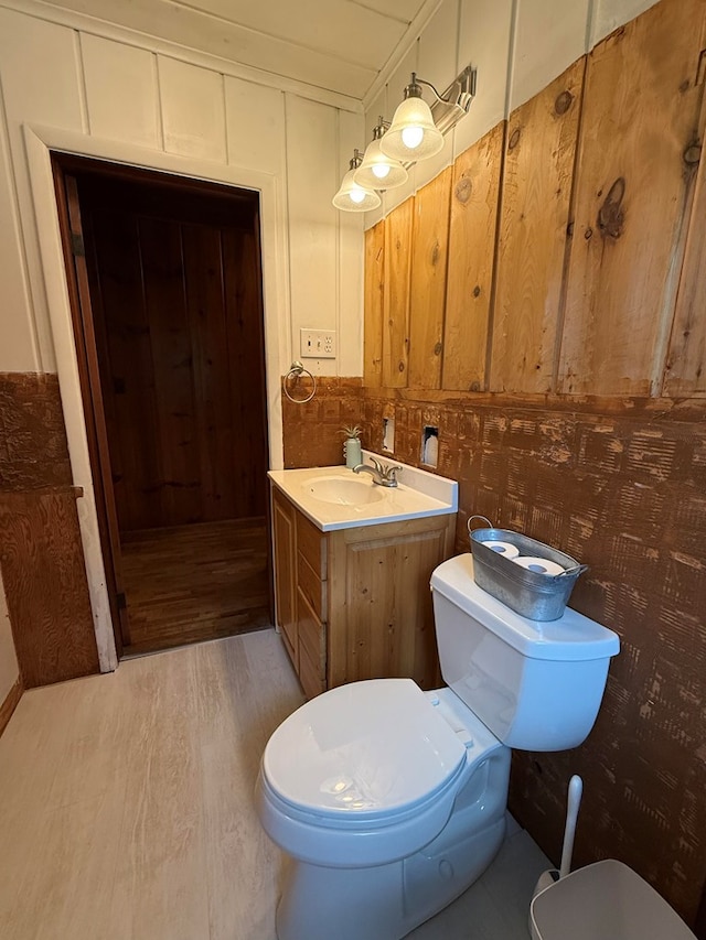 64234 Hwy 6, Green Castle, MO 63544 - bathroom featuring vanity, wood finished floors, and wooden walls
