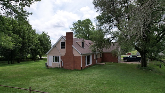 64234 Hwy 6, Green Castle, MO 63544 - view of home's exterior featuring brick siding, a yard, and a chimney