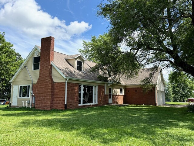 64234 Hwy 6, Green Castle, MO 63544 - rear view of house with brick siding, a yard, and a chimney