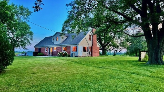 64234 Hwy 6, Green Castle, MO 63544 - back of house with a chimney, a lawn, and a porch