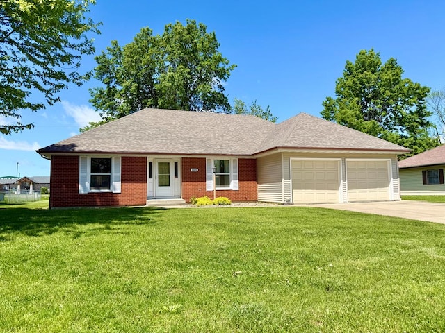 3405 Broadlawn Dr, Kirksville, MO 63501 - ranch-style house featuring an attached garage, a front yard, concrete driveway, and brick siding