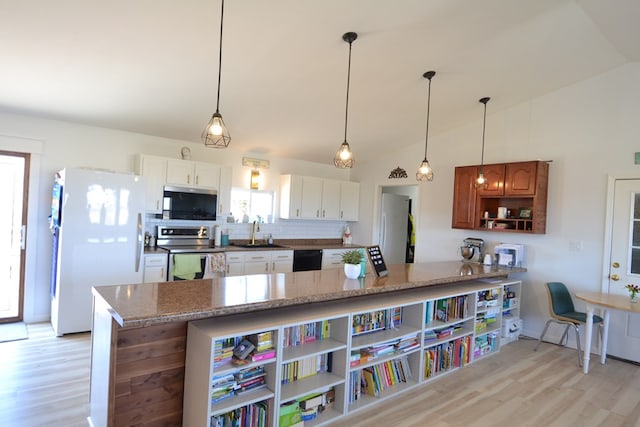kitchen featuring freestanding refrigerator, open shelves, stainless steel electric stove, a sink, and light wood-style flooring