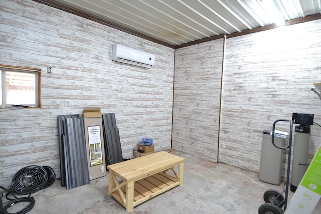 interior space featuring wooden walls and a wall unit AC