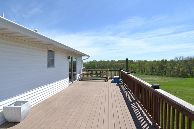 wooden deck with a yard