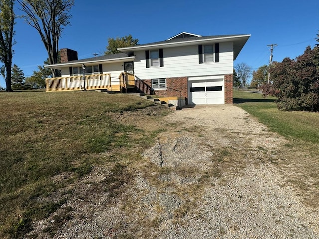 view of front of house with brick siding, a chimney, dirt driveway, an attached garage, and a front lawn