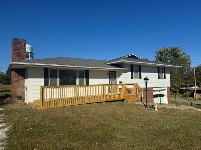 view of front facade with a front yard, brick siding, a chimney, and a wooden deck