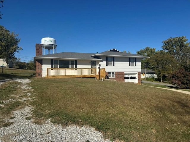 view of front of property with brick siding, a chimney, and a front lawn