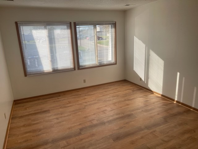 1302 Queens Ct, Kirksville, MO 63501 - spare room featuring light wood-style floors and baseboards