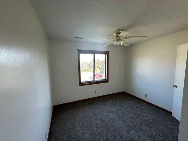 1302 Queens Ct, Kirksville, MO 63501 - spare room with dark colored carpet, ceiling fan, and baseboards
