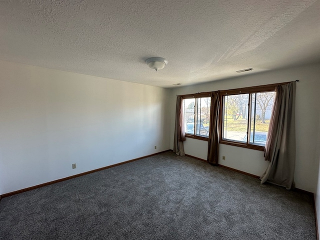 1302 Queens Ct, Kirksville, MO 63501 - carpeted empty room featuring a textured ceiling and baseboards