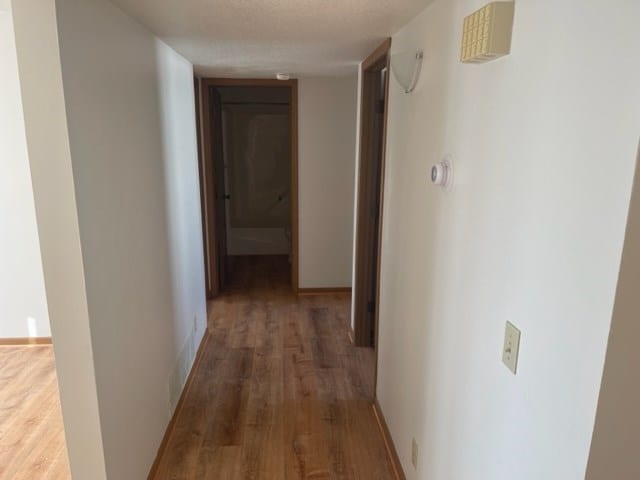 1302 Queens Ct, Kirksville, MO 63501 - hall featuring wood finished floors and baseboards