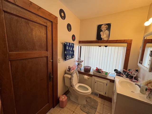 616 E Jefferson St, Kirksville, MO 63501 - bathroom with vanity, tile patterned floors, toilet, and visible vents