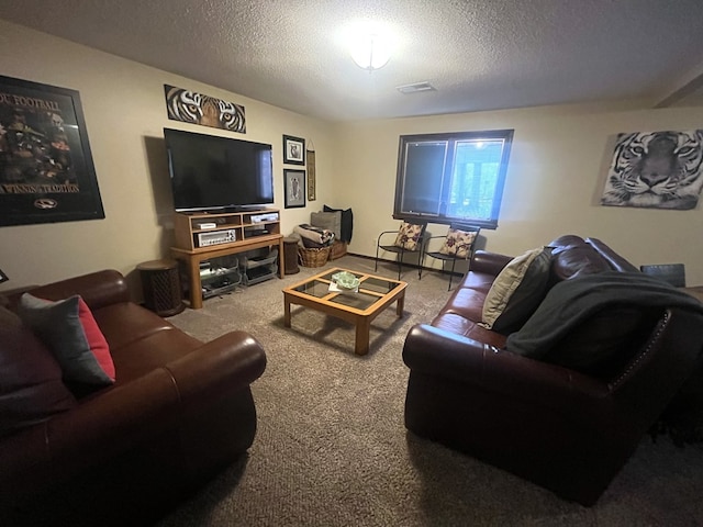 living room featuring a textured ceiling, visible vents, and carpet