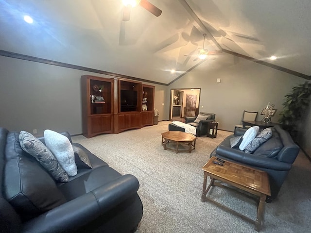 living area featuring carpet floors, ceiling fan, and lofted ceiling