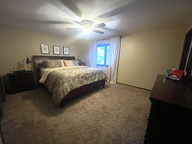 carpeted bedroom featuring a textured ceiling, ceiling fan, and baseboards