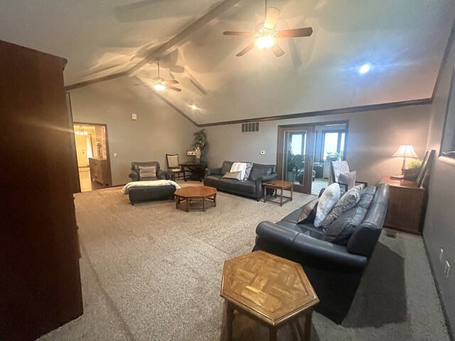 living area with carpet flooring, lofted ceiling with beams, a ceiling fan, and visible vents