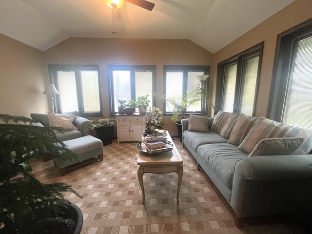 living room featuring light colored carpet, a ceiling fan, and lofted ceiling