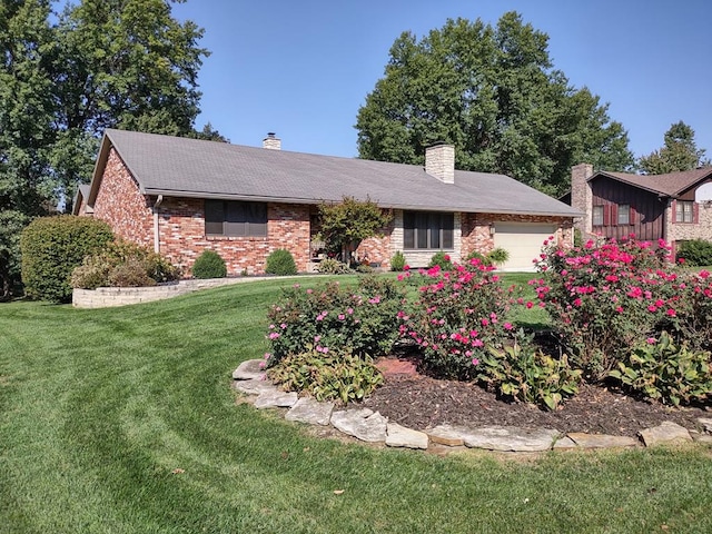 ranch-style home featuring brick siding, a garage, a front lawn, and a chimney