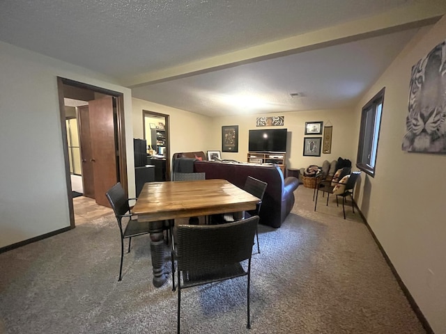 carpeted dining area with baseboards