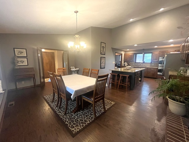 dining space with visible vents, a chandelier, recessed lighting, vaulted ceiling, and dark wood-style floors