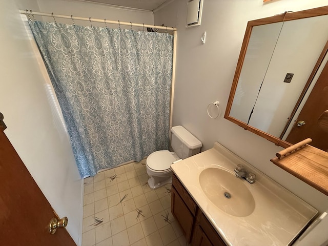 bathroom with tile patterned floors, toilet, vanity, and a shower with curtain