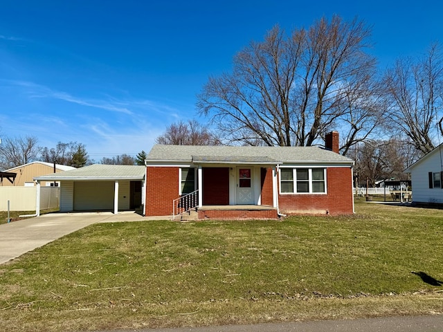 single story home with brick siding, driveway, a chimney, and a front lawn