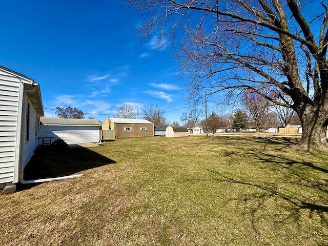 view of yard with a shed and an outdoor structure