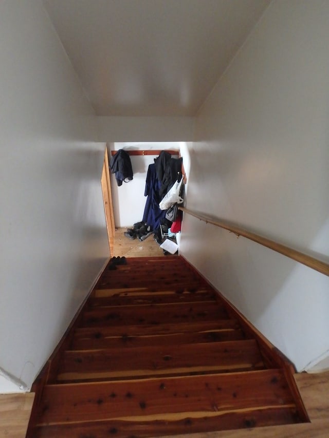 stairway featuring hardwood / wood-style flooring