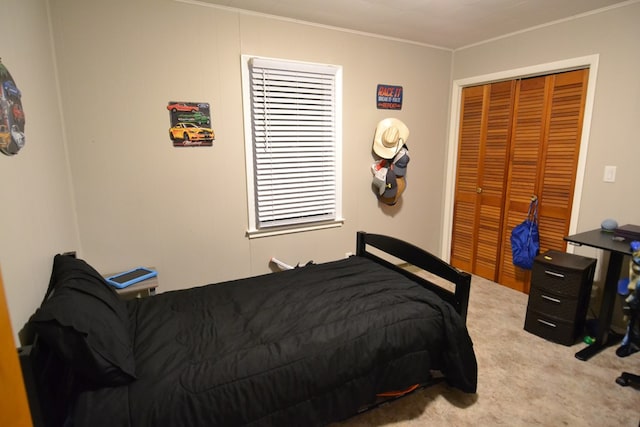 carpeted bedroom featuring ornamental molding and a closet