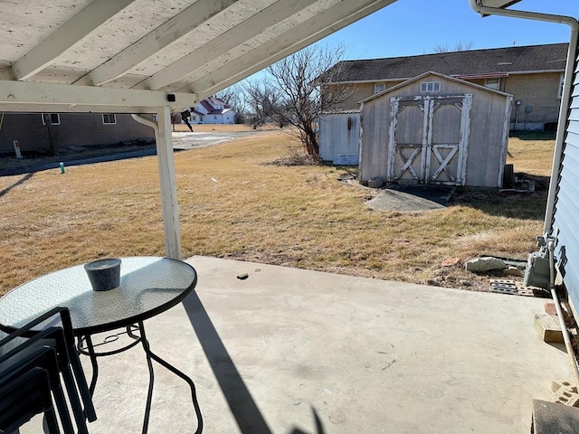 view of patio / terrace with an outbuilding and a storage shed