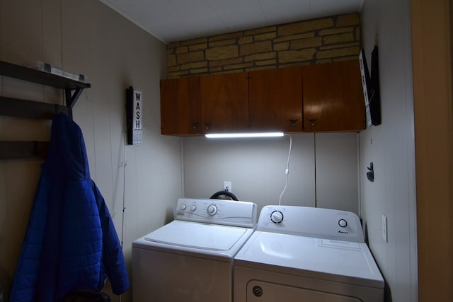 clothes washing area featuring separate washer and dryer