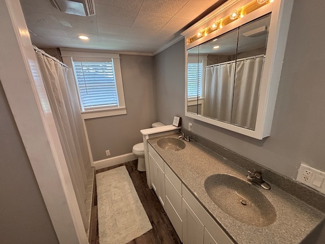 712 W Shelby, Kirksville, MO 63501 - full bath with double vanity, plenty of natural light, wood finished floors, crown molding, and a shower with shower curtain
