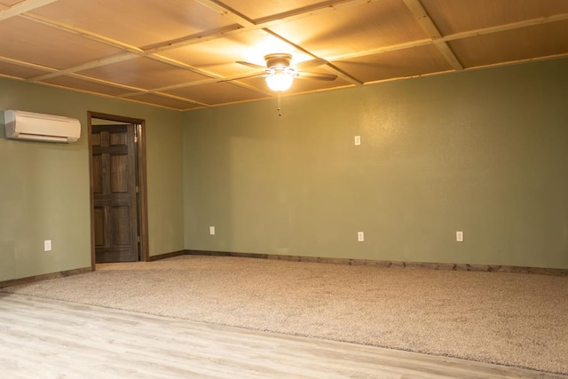 interior space featuring ceiling fan, hardwood / wood-style floors, and a wall mounted air conditioner