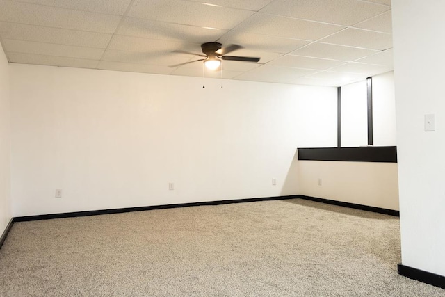 unfurnished room with a drop ceiling, ceiling fan, and light colored carpet