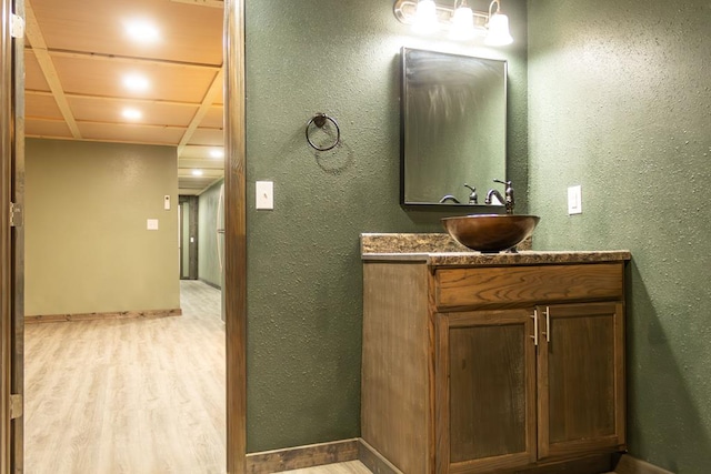 bathroom featuring hardwood / wood-style floors and vanity