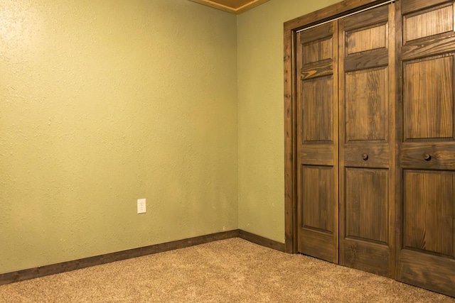 unfurnished bedroom featuring light colored carpet