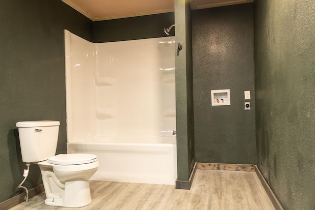 bathroom with hardwood / wood-style floors and toilet