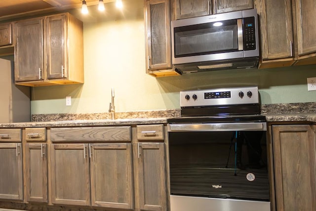 kitchen featuring stainless steel appliances and sink